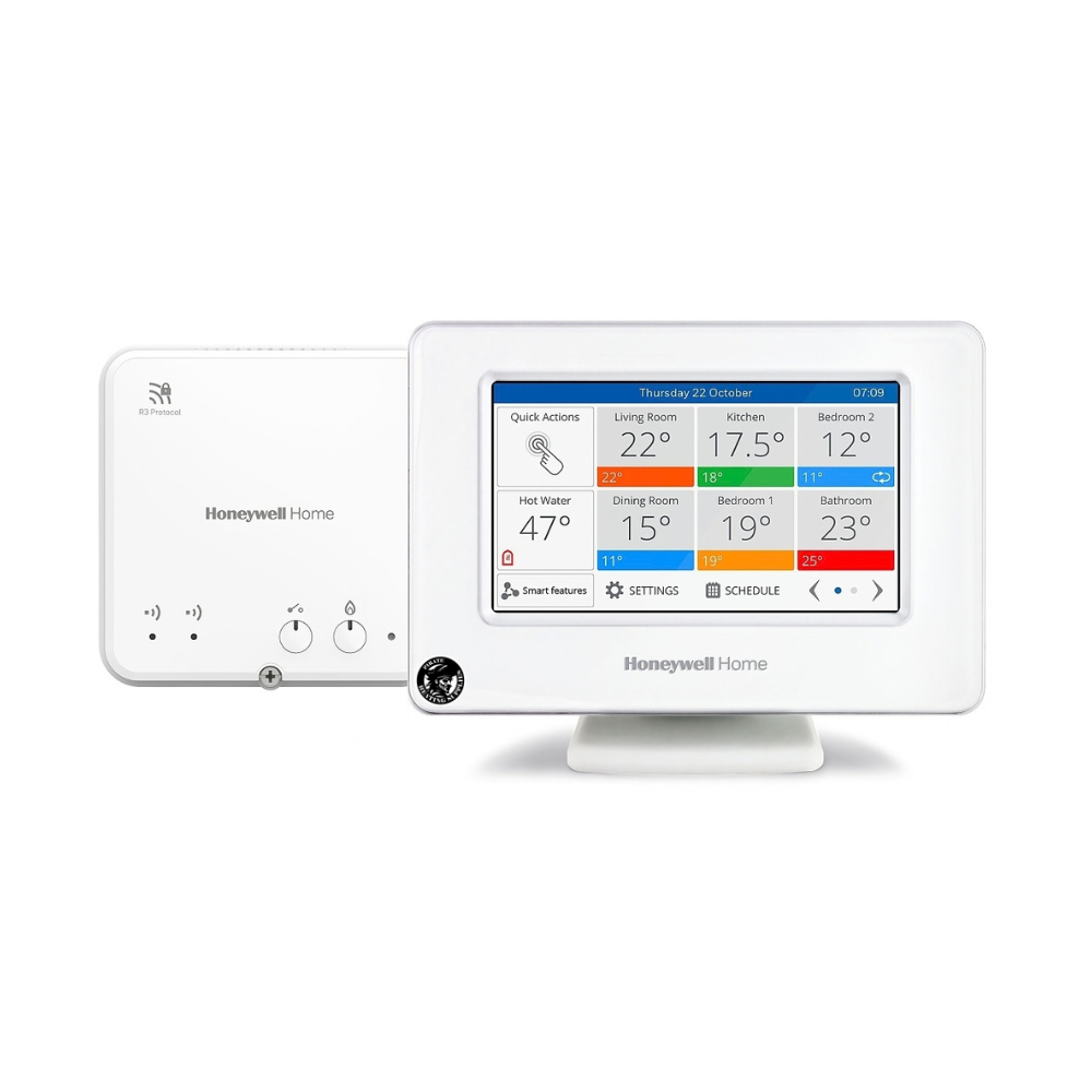 White Honeywell Home thermostat with a colorful touchscreen showing room temperatures and settings; a secondary white receiver is behind it.
